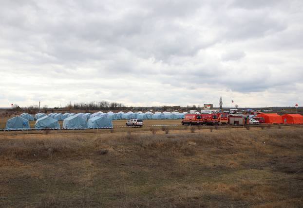 People flee from Ukraine to Moldova at the border crossing in Palanka