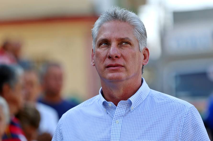 FILE PHOTO: Cuba's First Vice-President Miguel Diaz-Canel stands in line before casting his vote during an election of candidates for the national and provincial assemblies, in Santa Clara