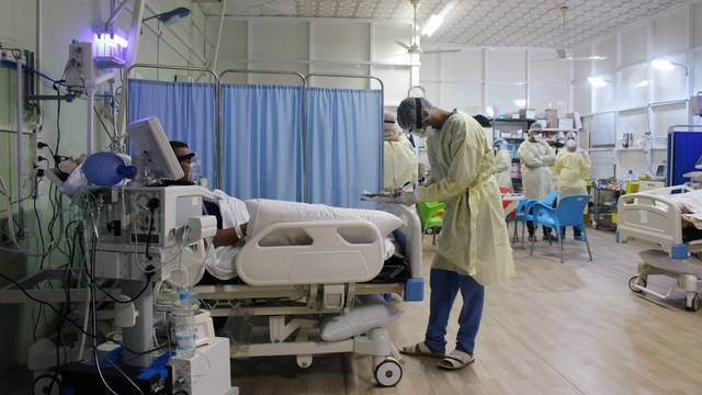 A doctor checks files of a patient infected with the coronavirus disease (COVID-19) at a quarantine center run by the International aid group Medecins Sans Frontieres (Doctors Without Borders) in Aden