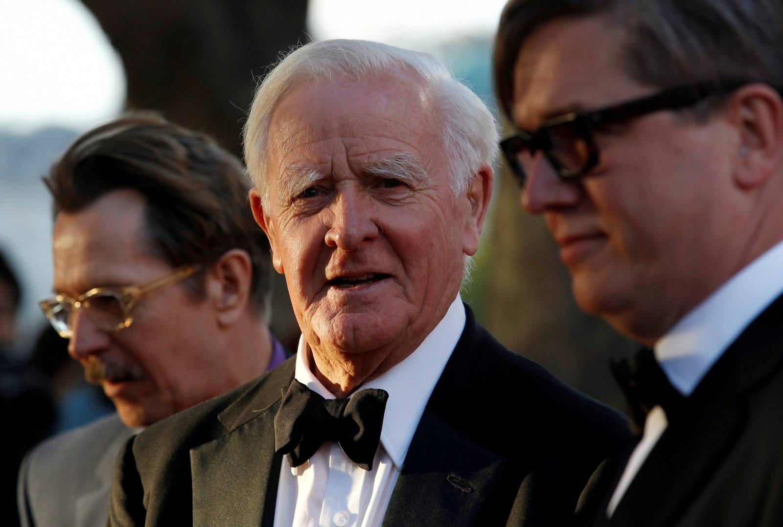 FILE PHOTO: British author John Le Carre poses for photographers with British actor Gary Oldman and Swedish director Tomas Alfredson at the UK premiere of Tinker Tailor Soldier Spy in London