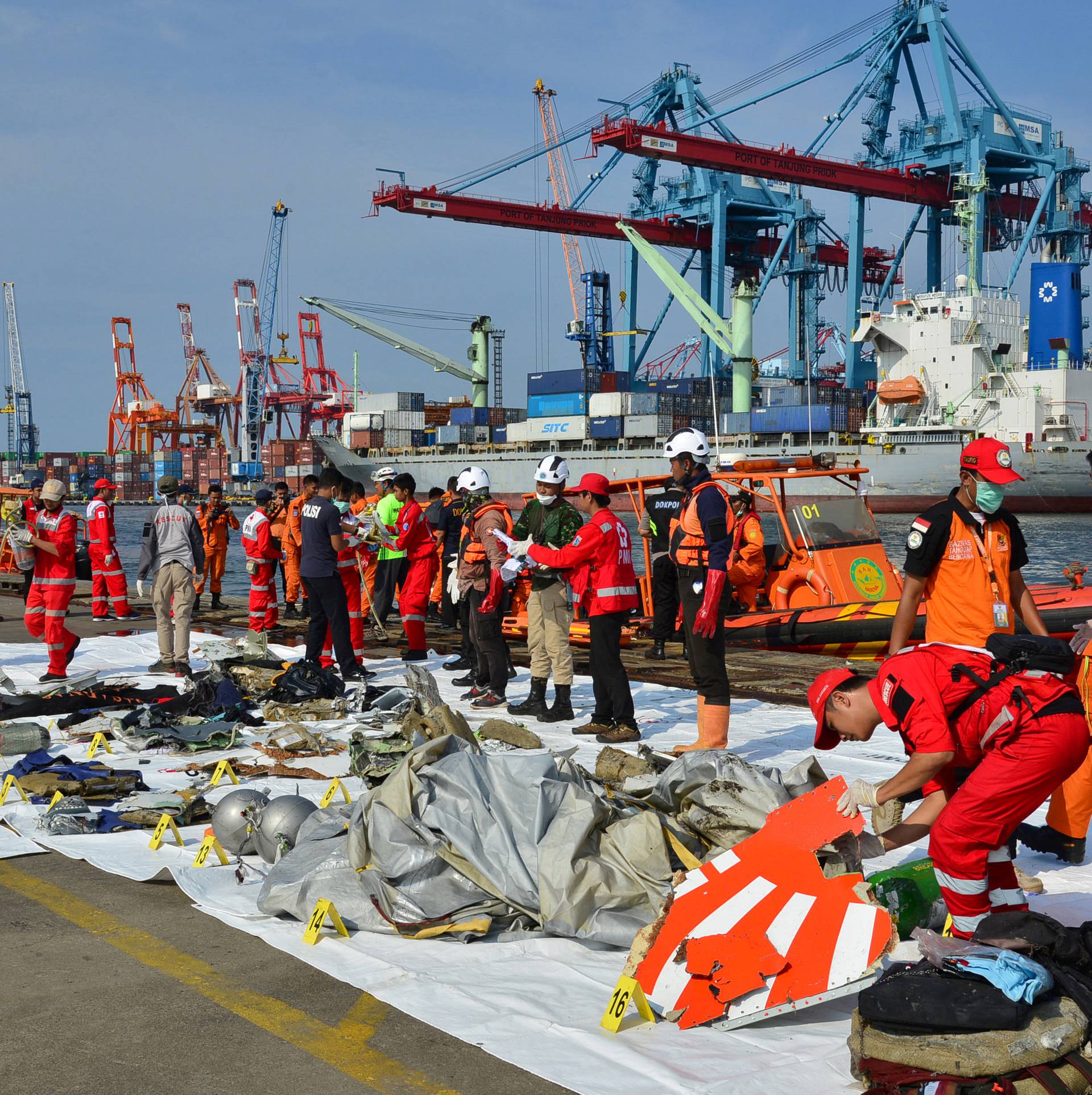 Rescue team members arrange Lion Air flight JT610 wreckage at Tanjung Priok port in Jakarta