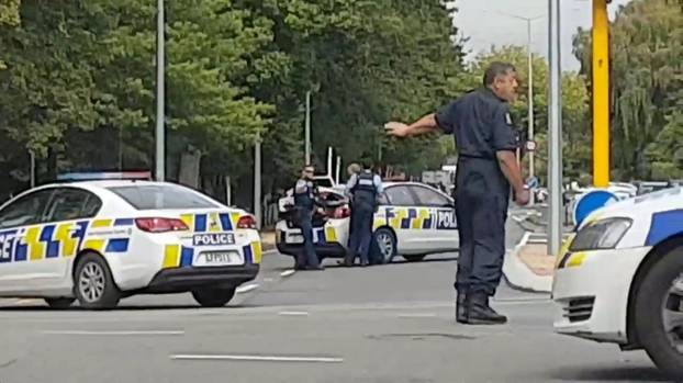 Social media video grab of police directing traffic at a road junction following reports of shootings at two mosques in Christchurch