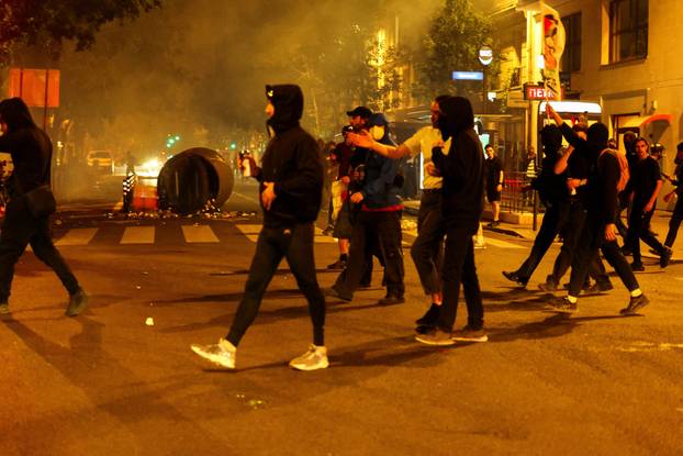 People protest against the French far-right Rassemblement National party, following partial results in the first round of the early 2024 legislative elections, in Paris
