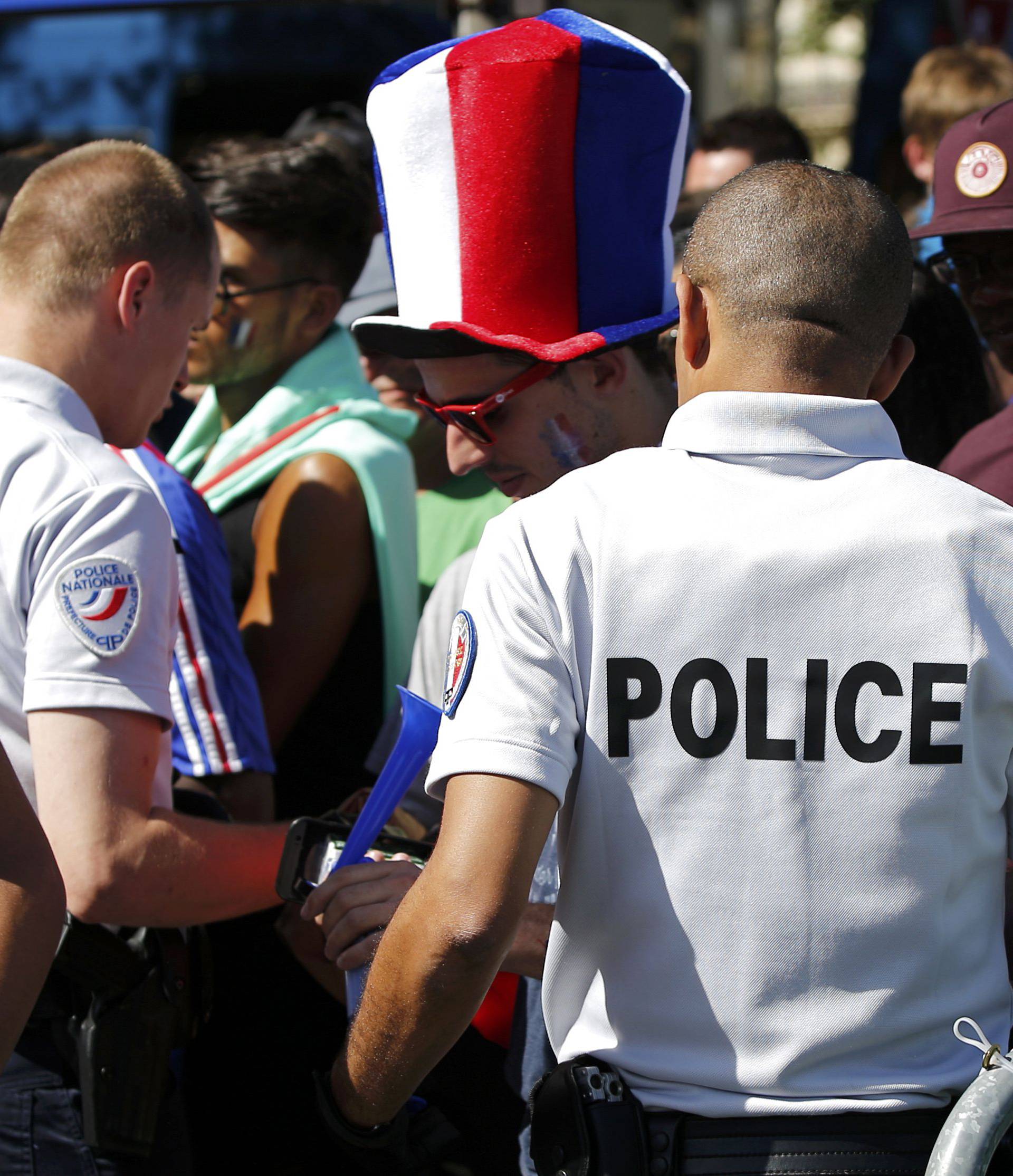 Security check near the Paris fan zone during a EURO 2016 final soccer match       