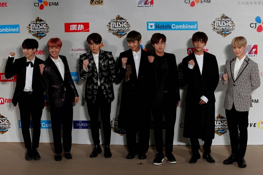 FILE PHOTO: Members of South Korean K-pop band BTS pose during Mnet Asian Music Awards in Hong Kong