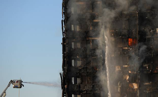 Firefighters tackle a serious fire in a tower block at Latimer Road in West London