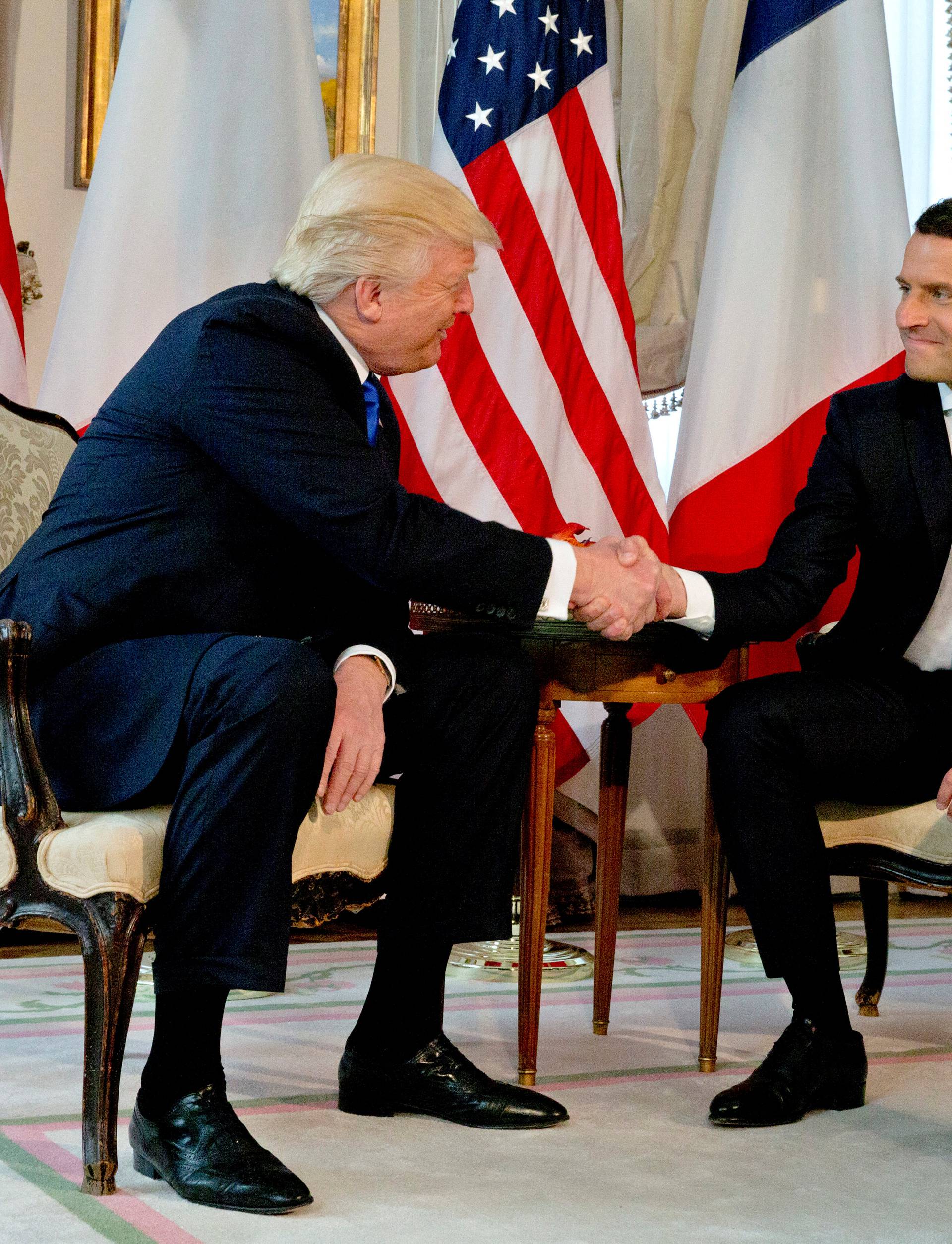 U.S. President Donald Trump meets French President Emmanuel Macron before a working lunch ahead of a NATO Summit in Brussels
