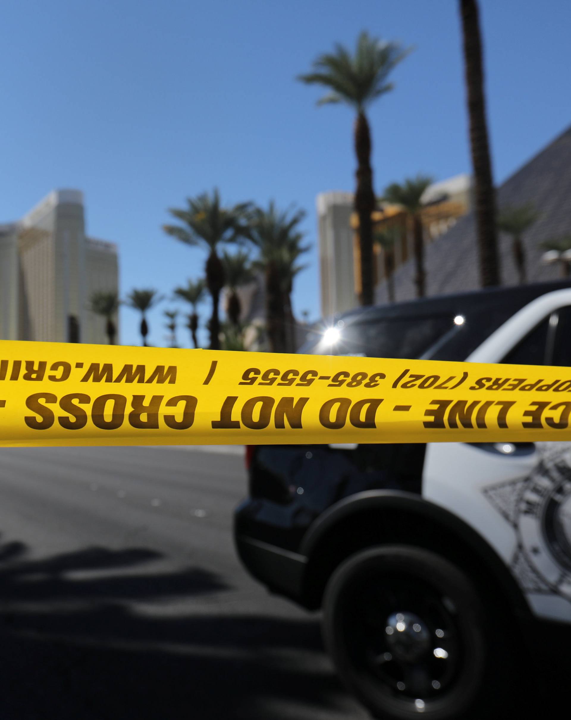 Police crime scene tape marks a perimeter outside the Luxor Las Vegas hotel and the Mandalay Bay Resort and Casino in Las Vegas