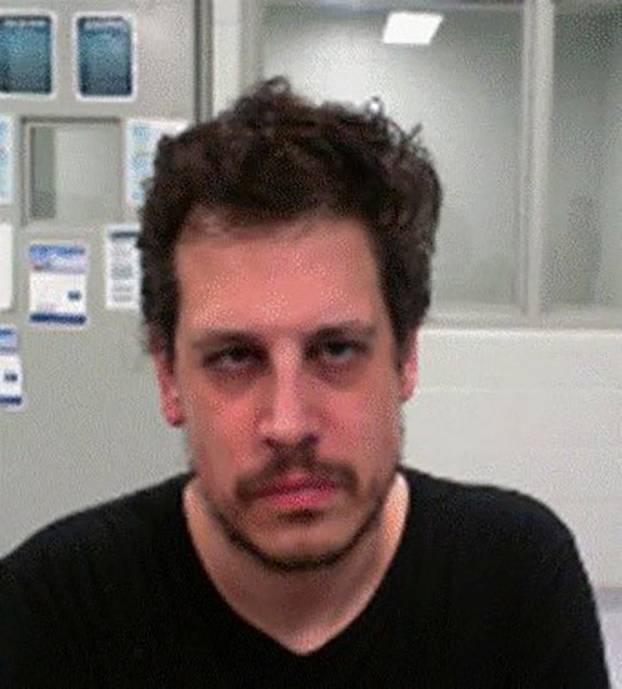 Milo Yiannopoulos poses after his arrest by federal immigration agents at the Louis Armstrong New Orleans International Airport