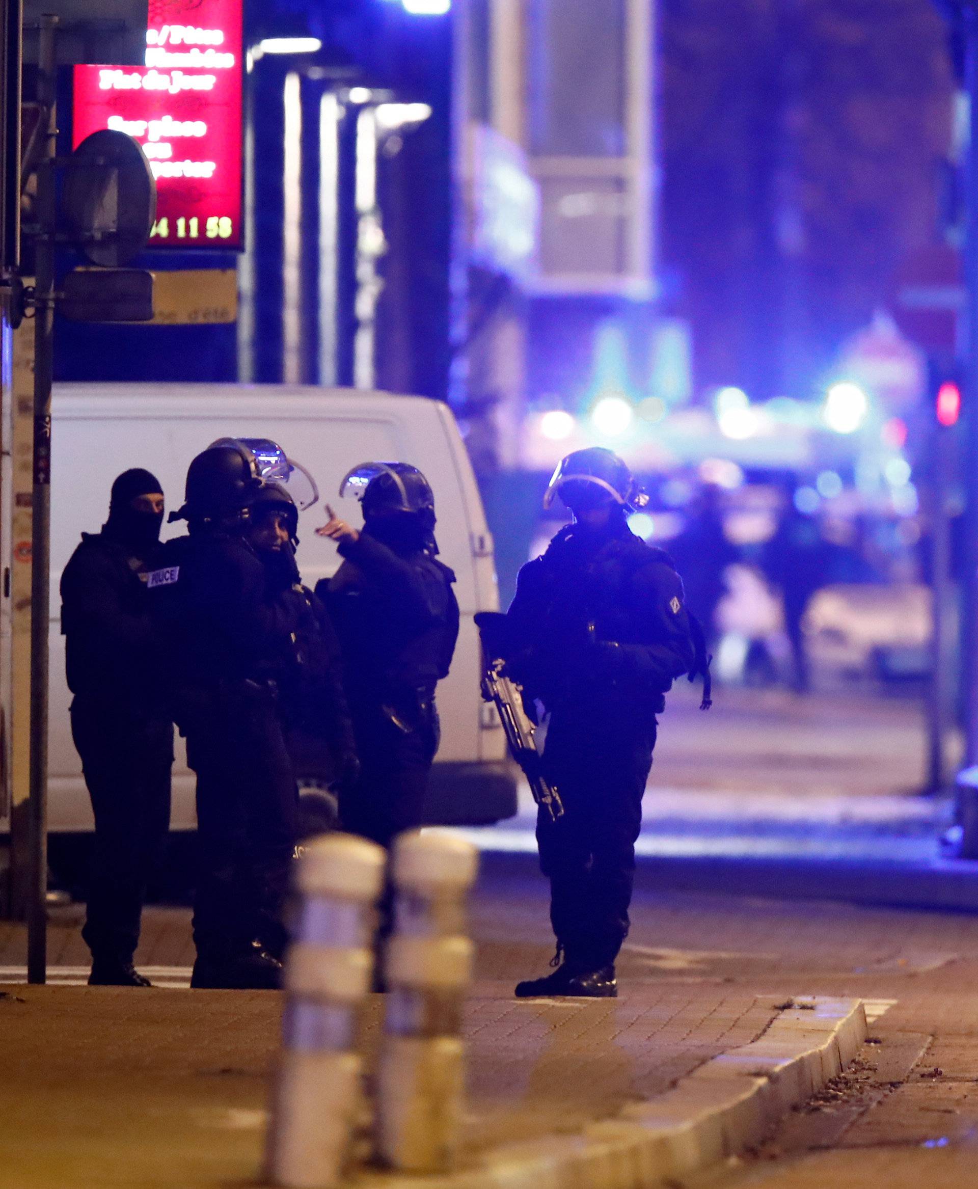 French special police forces secure an area during a police operation in the Meinau district after the deadly shooting in Strasbourg
