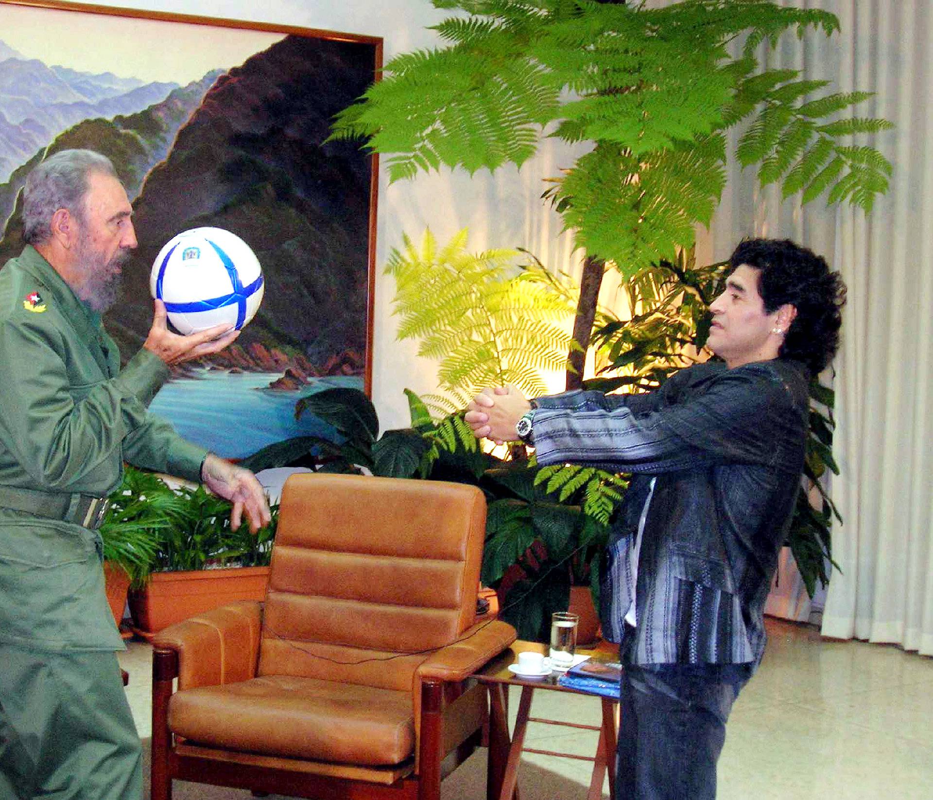 File photo of Cuban President Castro and Argentine soccer legend Maradona playing with a ball during an interview in La Havana