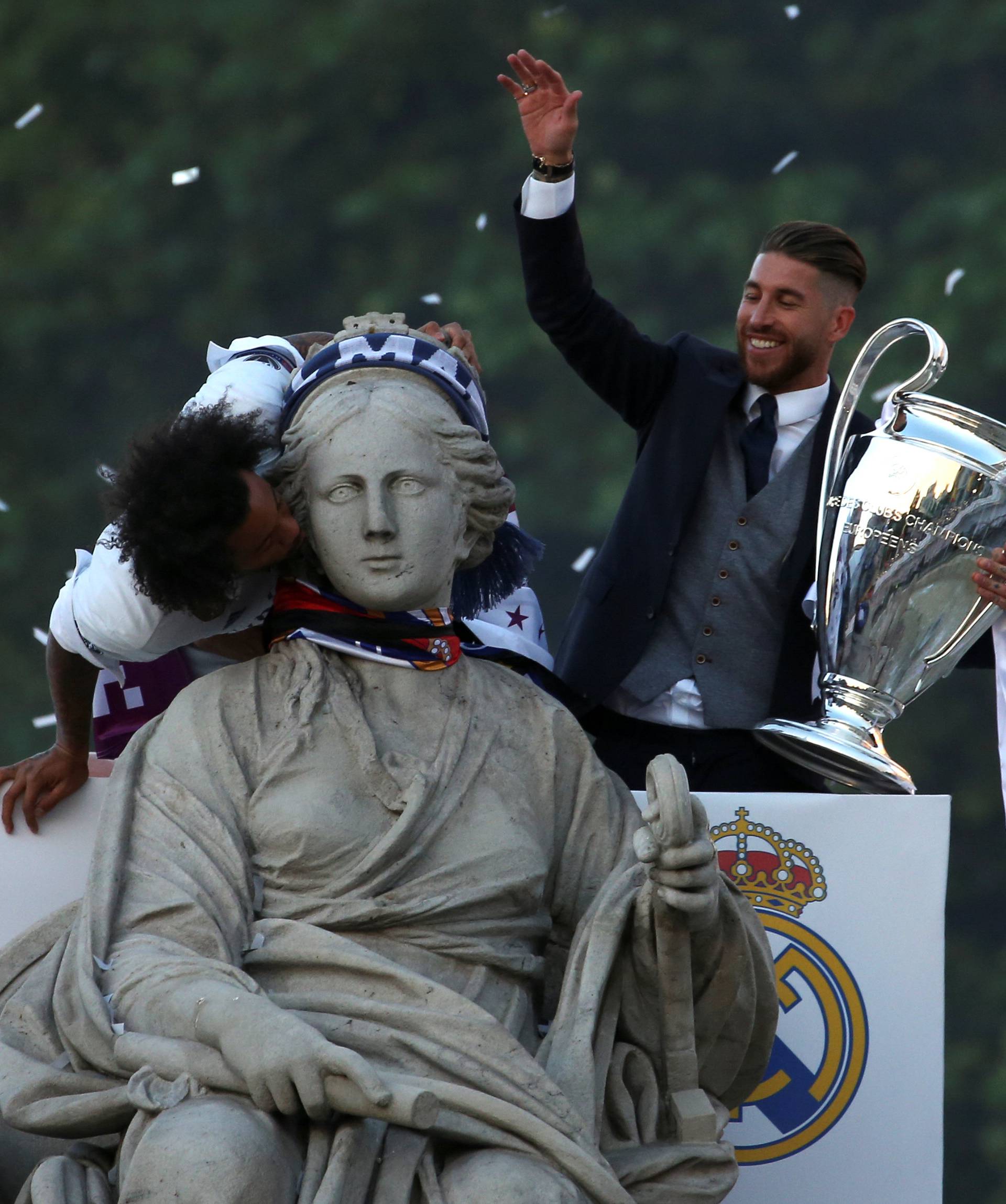 Real Madrid's Sergio Ramos and Marcelo celebrate Champions League title at Cibeles Fountain in Madrid
