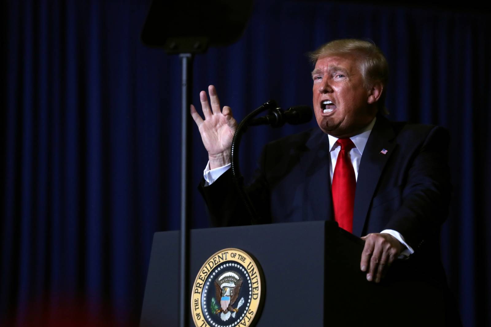 U.S. President Donald Trump reacts during a campaign rally in Tupelo,