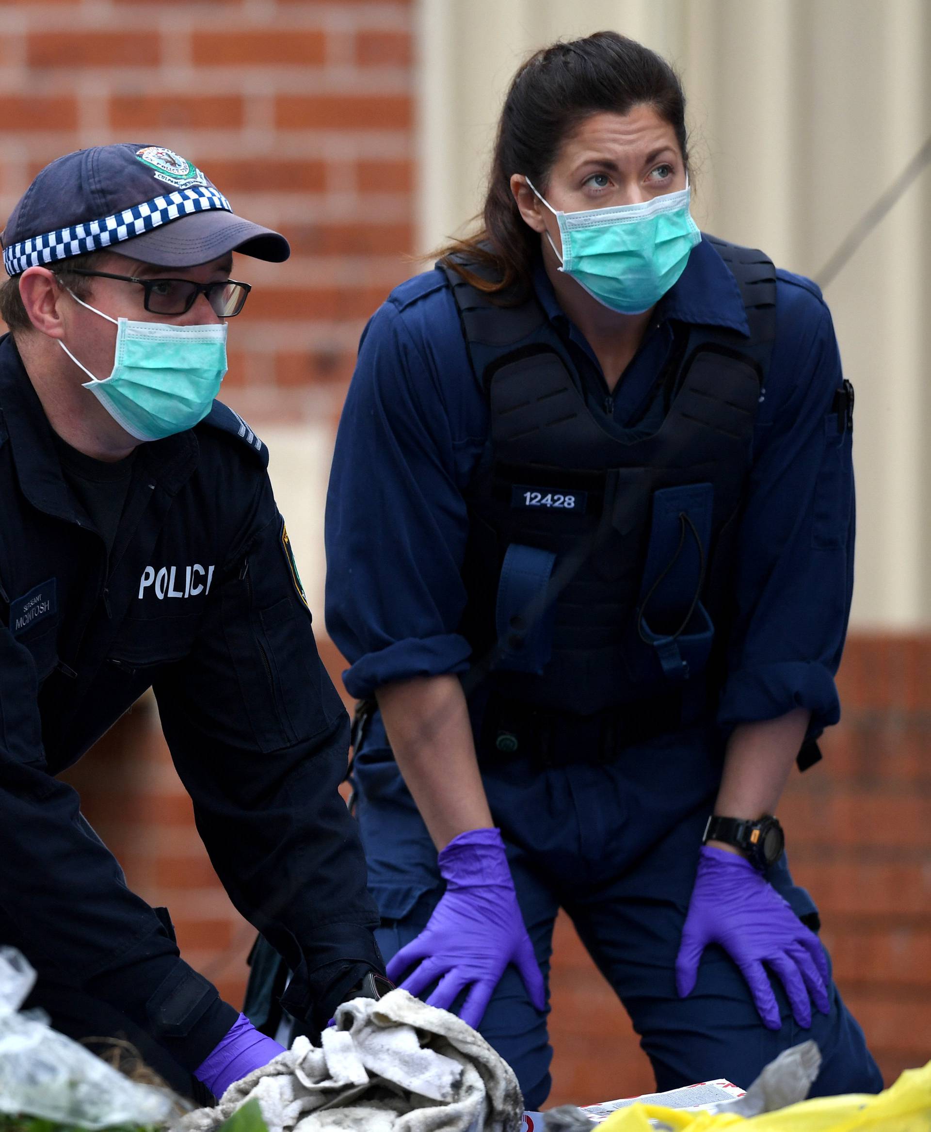 Australian police search items seized from a property during a raid in the Sydney suburb of Lakemba