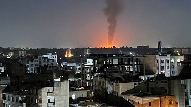 Smoke rises in the sky following U.S-led airstrikes in Sanaa