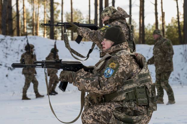 Witches of Bucha, a group of female volunteer soldiers, undergo tactical shooting training in Kyiv - 08 Feb 2025