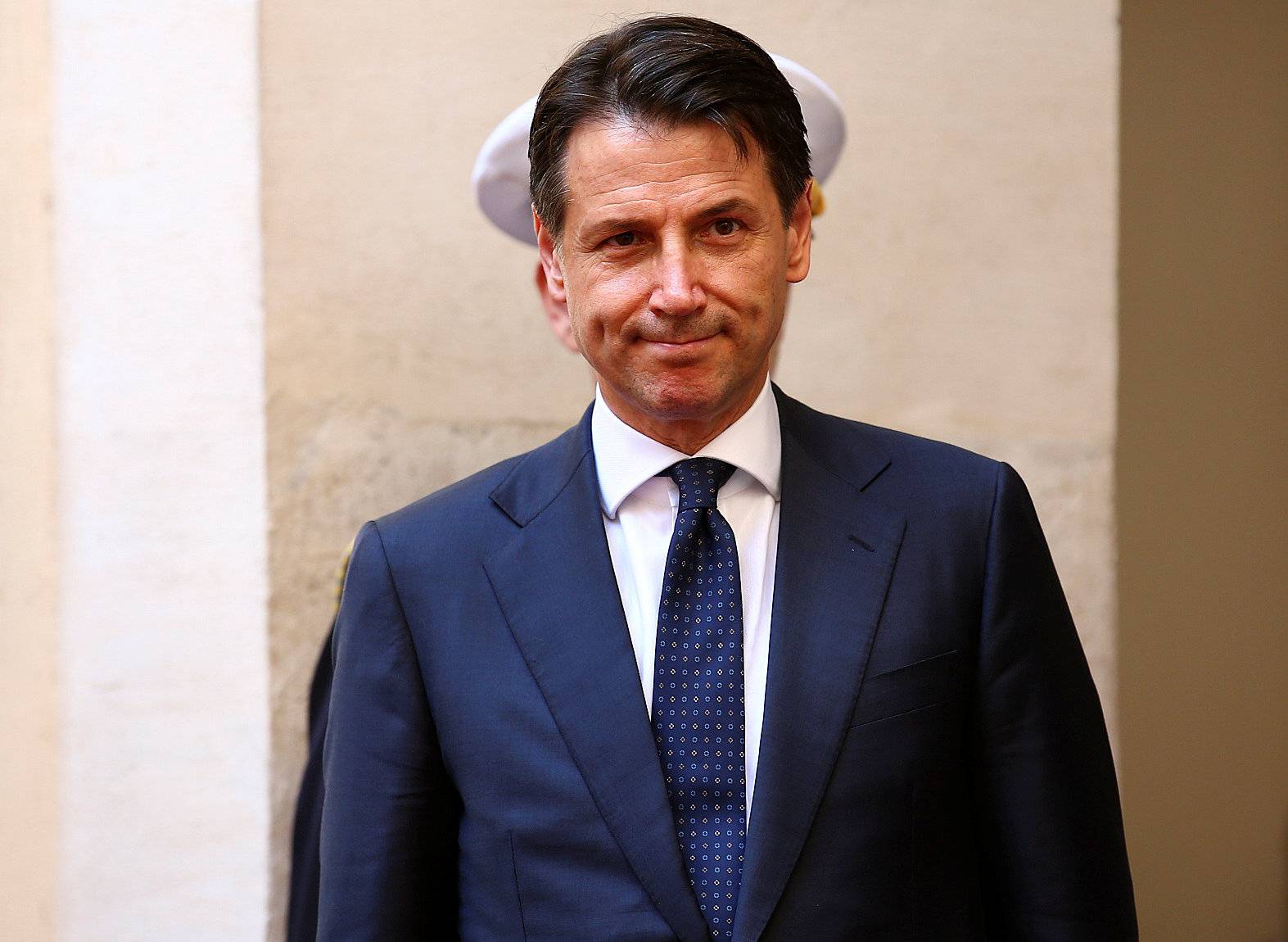 Italy's Prime Minister-designate Giuseppe Conte review the guard of honour at Chigi palace in Rome