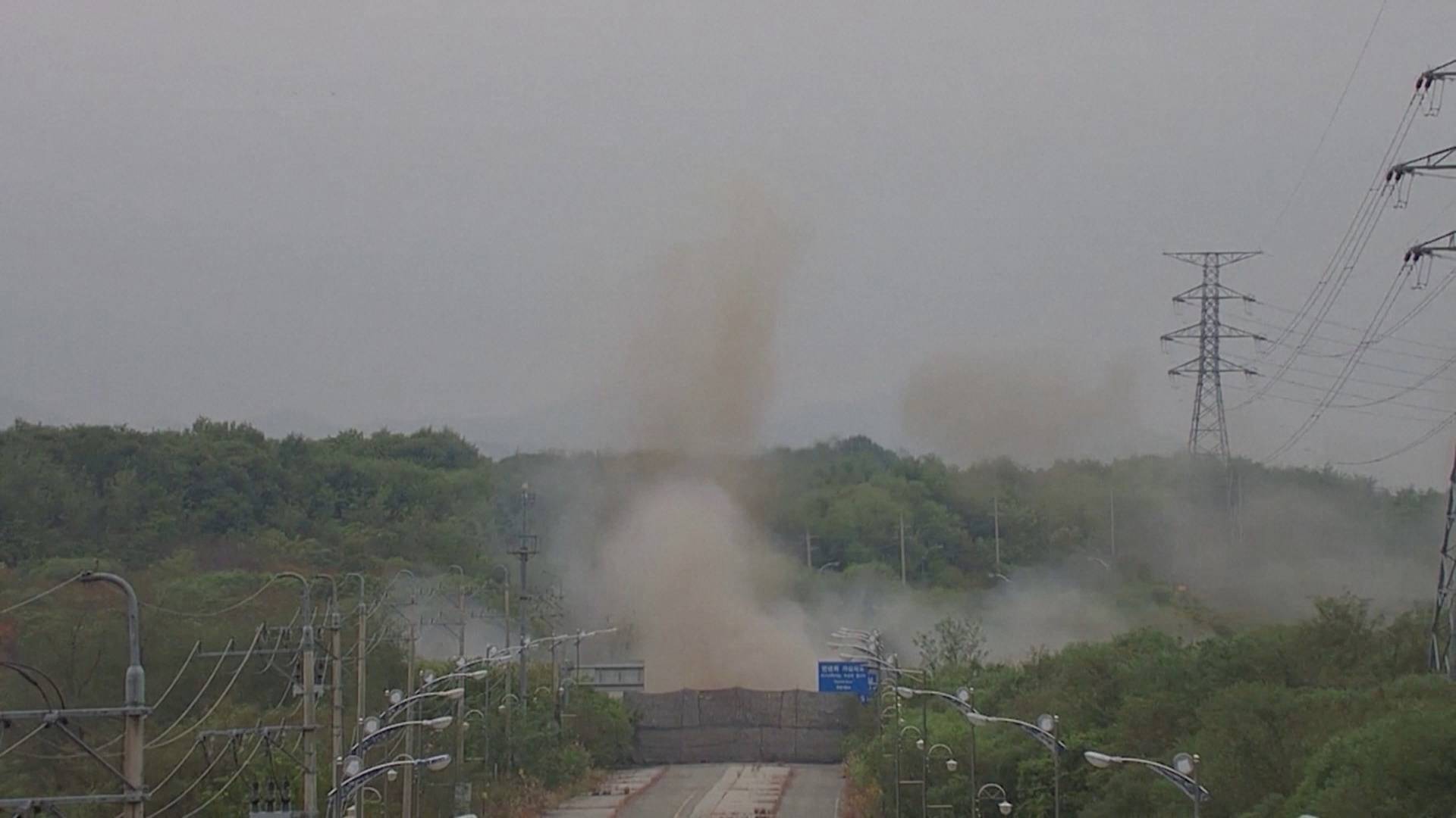 Smoke rises after North Korea blows up sections of inter-Korean roads on its side of the border between the two Koreas, as seen from the South Korean side