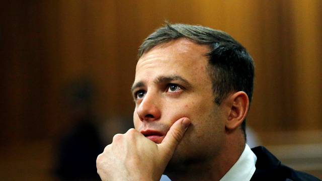 FILE PHOTO: Olympic and Paralympic track star Oscar Pistorius looks on ahead of his sentencing hearing in Pretoria
