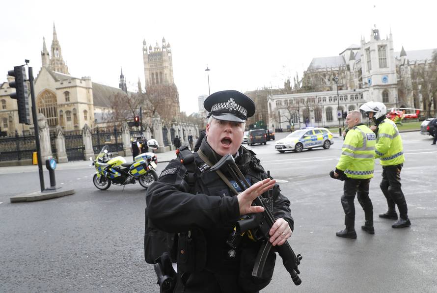 Armed police respond outside Parliament during an incident on Westminster Bridge in London