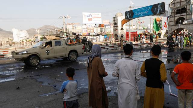 A Taliban car is seen guarding at the site of a blast in Kabul
