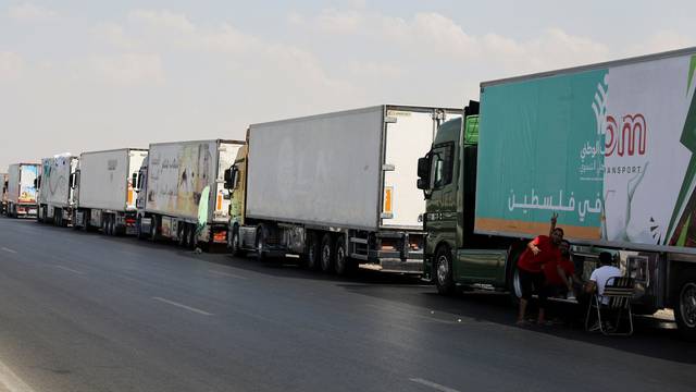 Trucks carrying humanitarian aid to Palestinians are waiting on the desert road (Cairo - Ismailia) on their way to the Rafah crossing