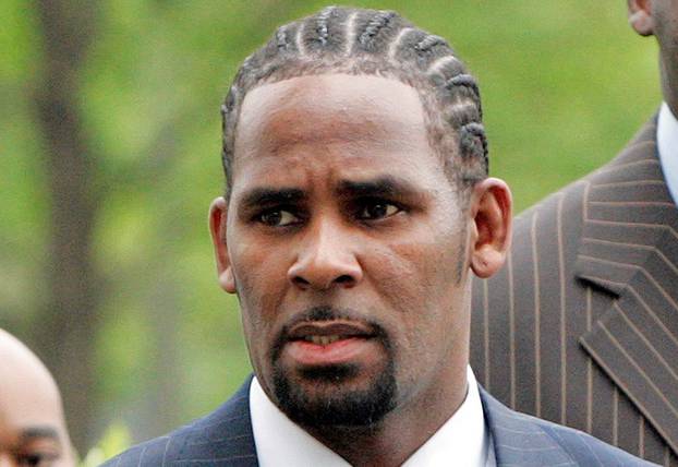 FILE PHOTO: Recording artist R. Kelly arrives at the Cook County Criminal Courthouse for the first day of his trial in Chicago