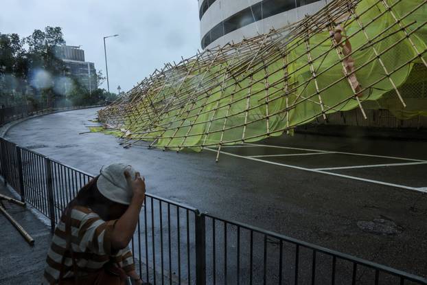 Collapsed bamboo scaffolds of a residential building are seen as Typhoon Wipha approaches, in Hong Kong