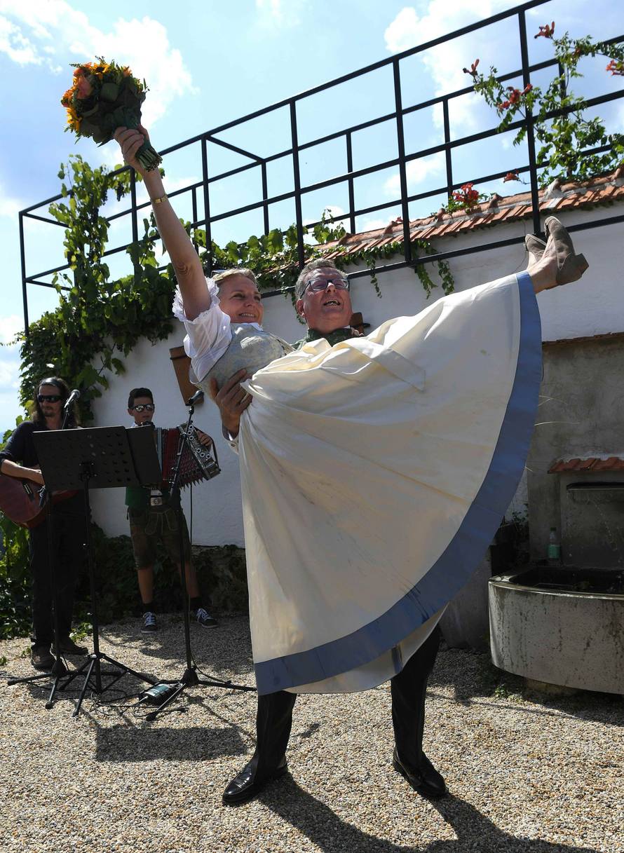 Austria's Foreign Minister Kneissl and her groom Meilinger celebrate their wedding in Gamlitz