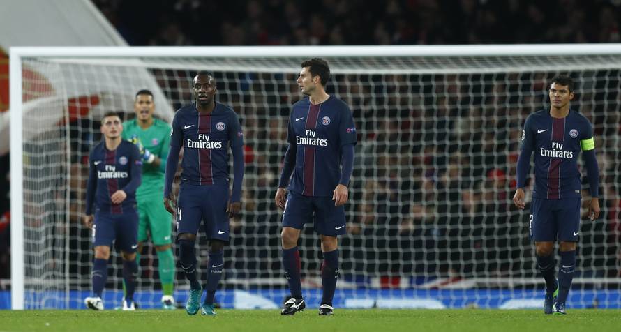Paris Saint-Germain's Blaise Matuidi, Thiago Motta and Thiago Silva look dejected after Marco Verratti scores an own goal and the second goal for Arsenal