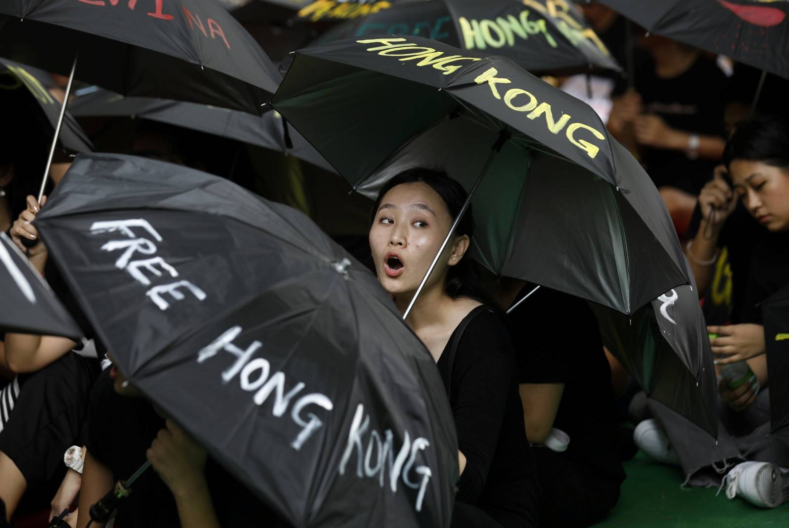A Tibetan exile shouts slogan during a protest to support Hong Kong pro-democracy protestors, in New Delhi