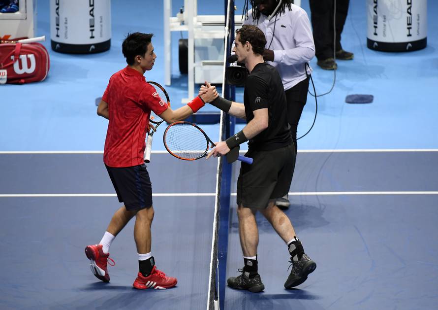 Great Britain's Andy Murray and Japan's Kei Nishikori shake hands after their round robin match