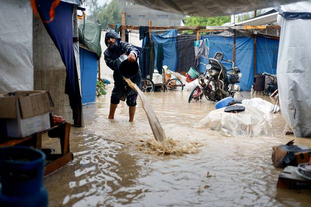 Displaced Palestinians shelter in a tent camp in Nuseirat