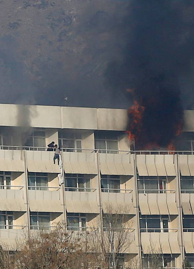 A man tries to escape from a balcony at Kabul