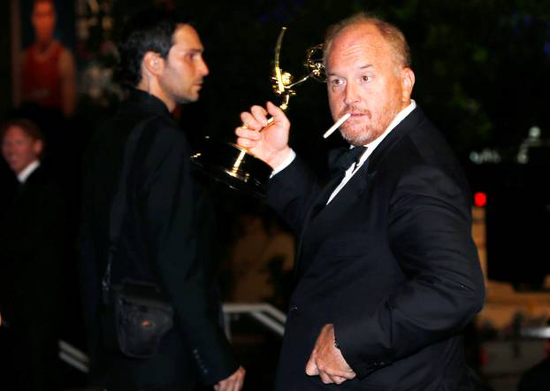 FILE PHOTO: Louis C.K. with his Outstanding Writing for a Comedy Series for FX Networks "Louie" arrives at the Governors Ball for the 66th Primetime Emmy Awards in Los Angeles