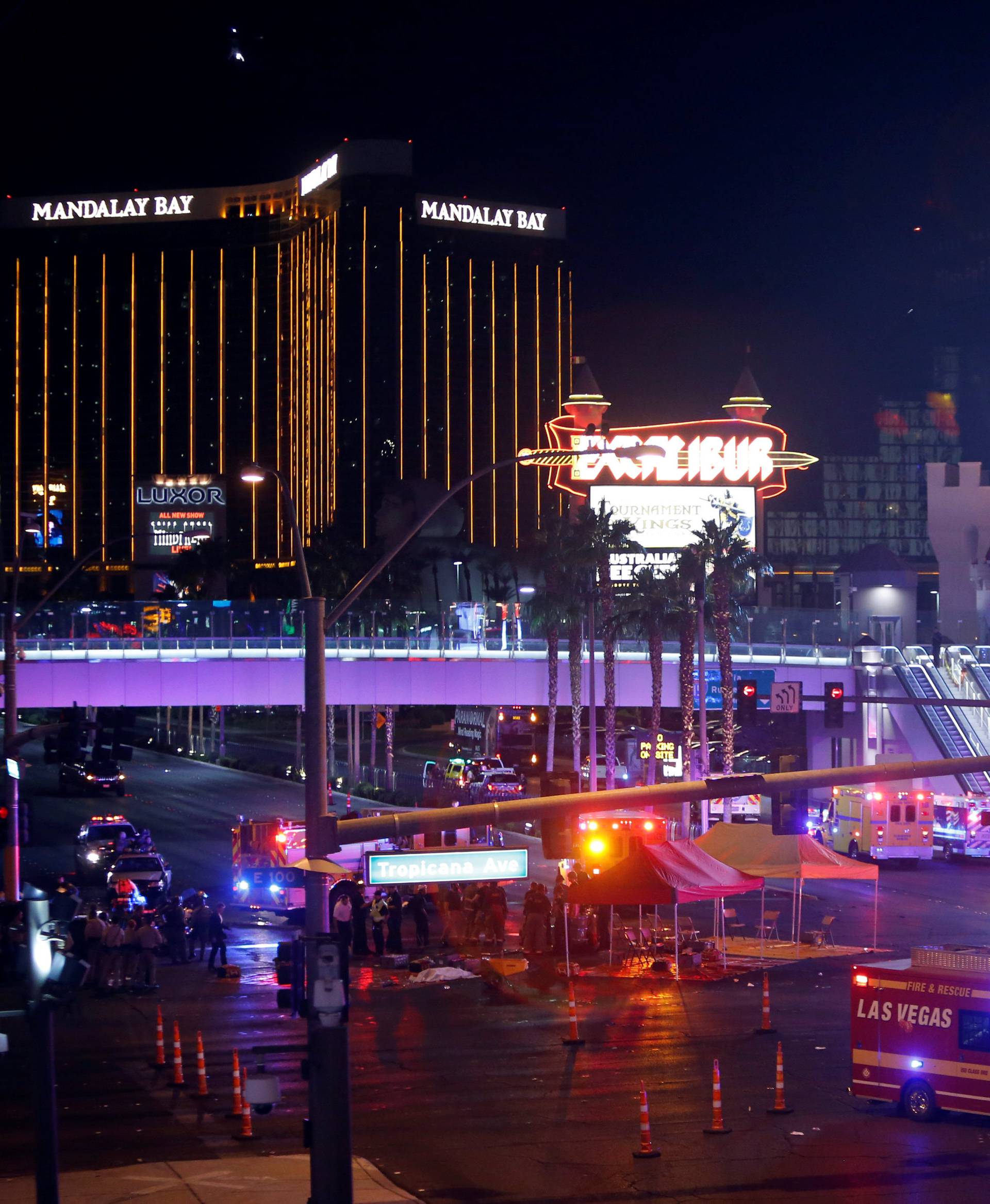 Las Vegas Metro Police and medical workers stage in the intersection of Tropicana Avenue and Las Vegas Boulevard South after a mass shooting at a music festival on the Las Vegas Strip in Las Vegas