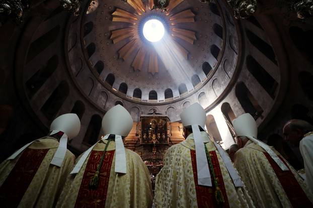 Members of the clergy take part in the Catholic Washing of the Feet ceremony on Easter Holy Week in the Church of the Holy Sepulchre in Jerusalem