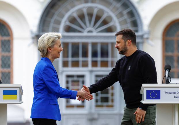 European Commission President von der Leyen and Ukraine's President Zelenskiy shake hands after a joint press conference in Kyiv