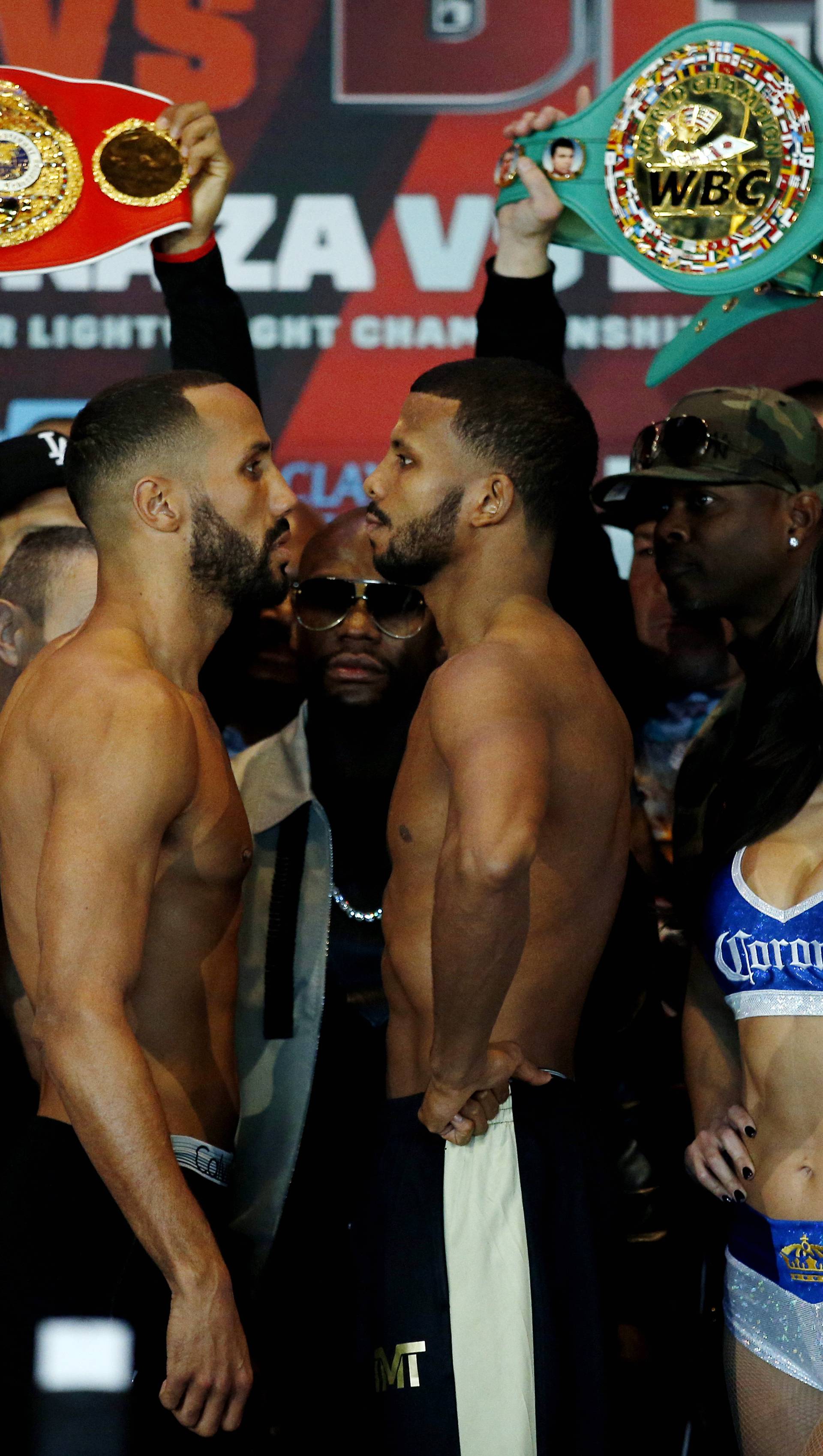 James DeGale and Badou Jack pose during the weigh in with Floyd Mayweather