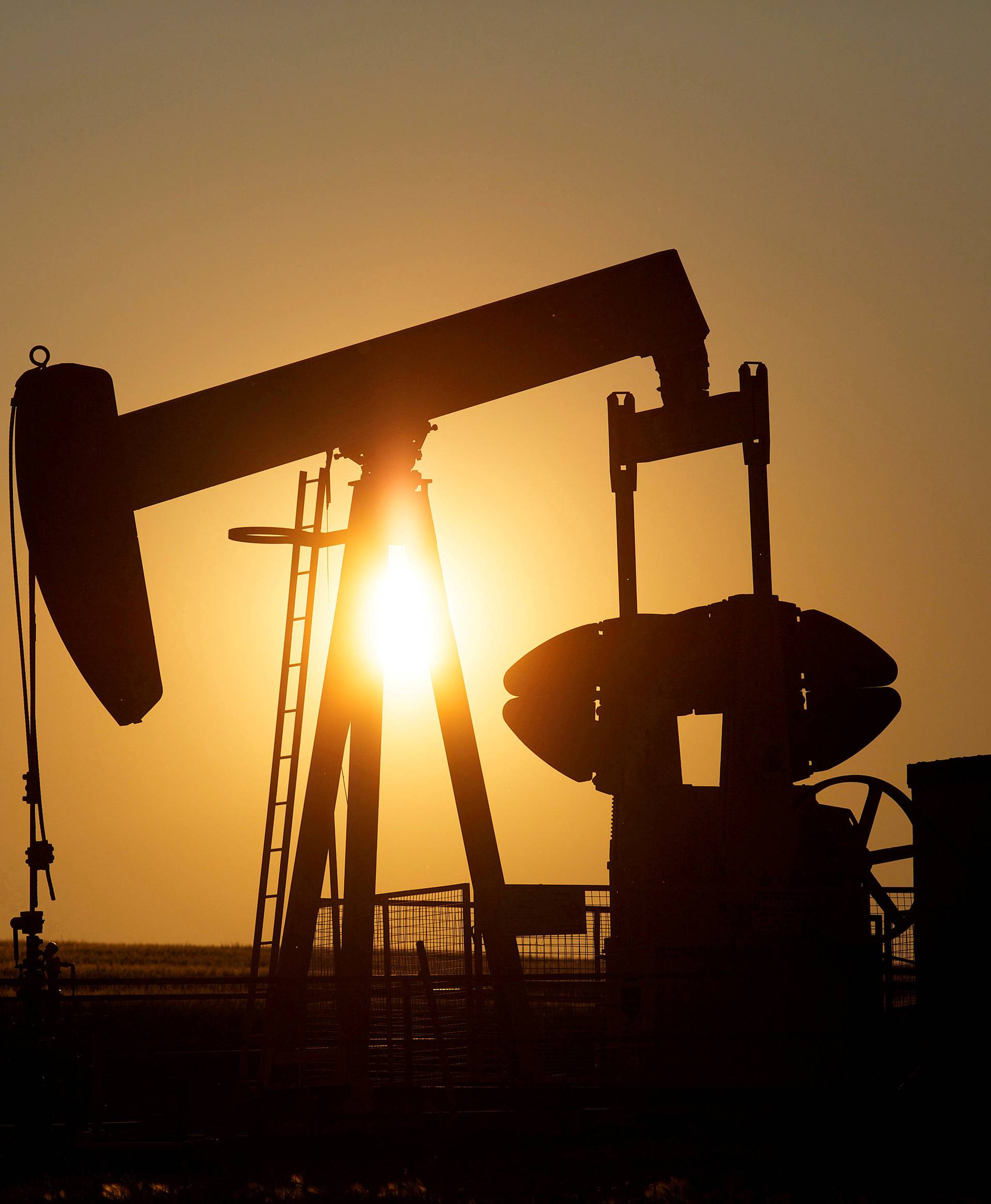 FILE PHOTO: An oil pump jack pumps oil in a field near Calgary