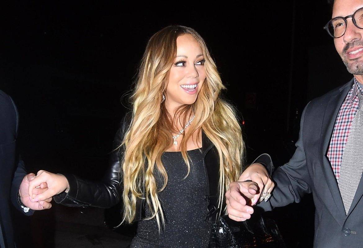 Mariah Carey gets escorted inside at Craig's restaurant