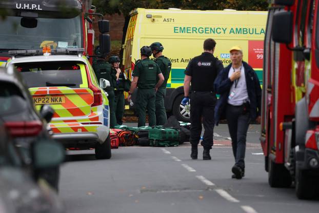 Police officers work at the scene following an incident outside a synagogue, in Manchester