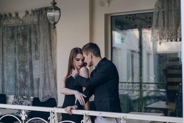 Beautiful couple on balcony