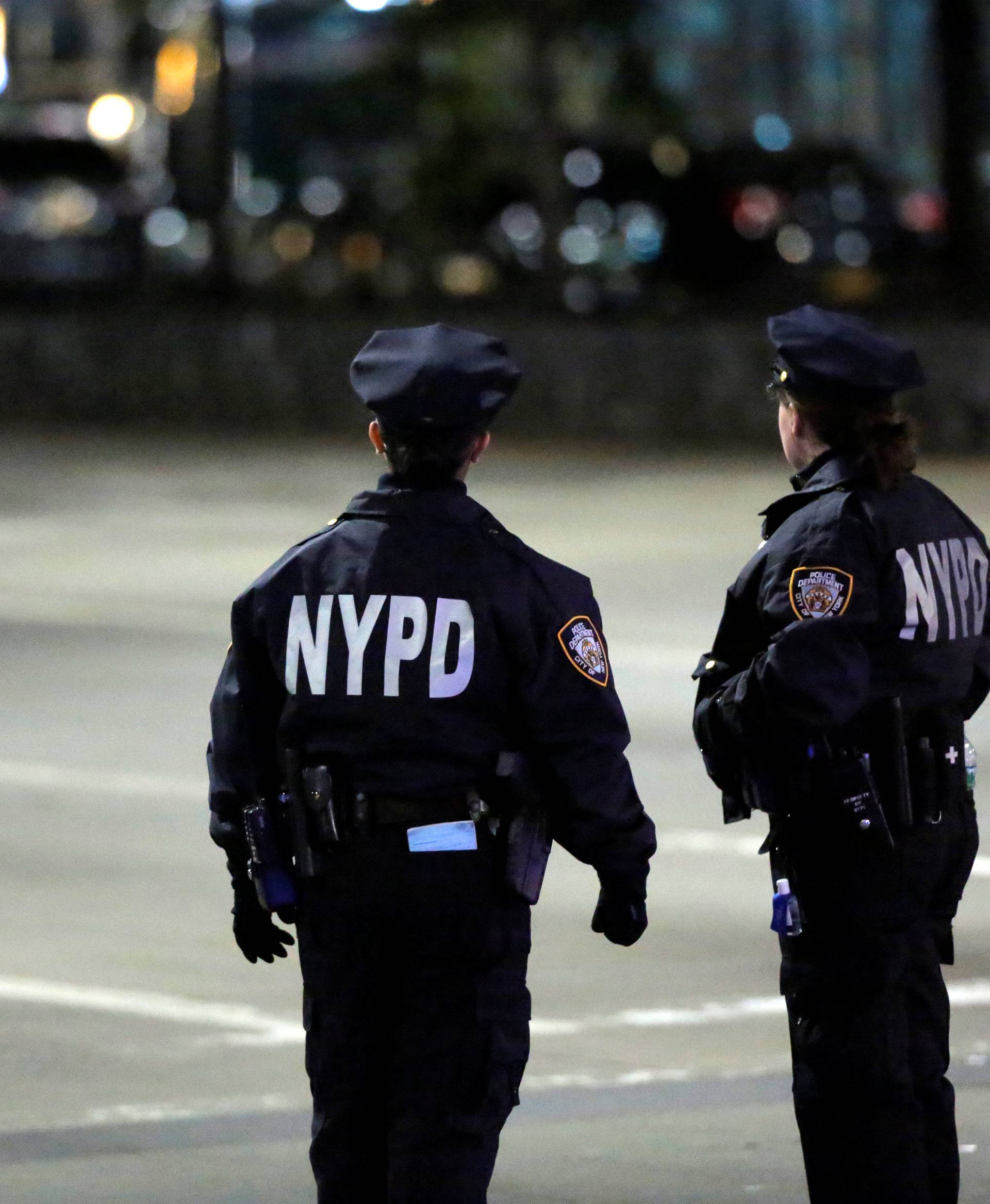 Police look towards the scene of a pickup truck attack on West Side Highway in Manhattan, New York