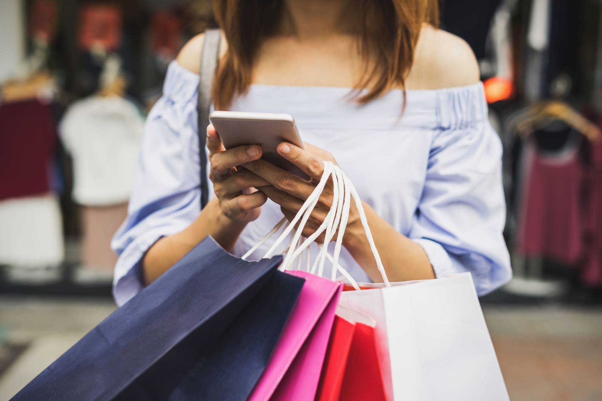 Young,Woman,With,Shopping,Bags,Walking,And,Shopping,In,The