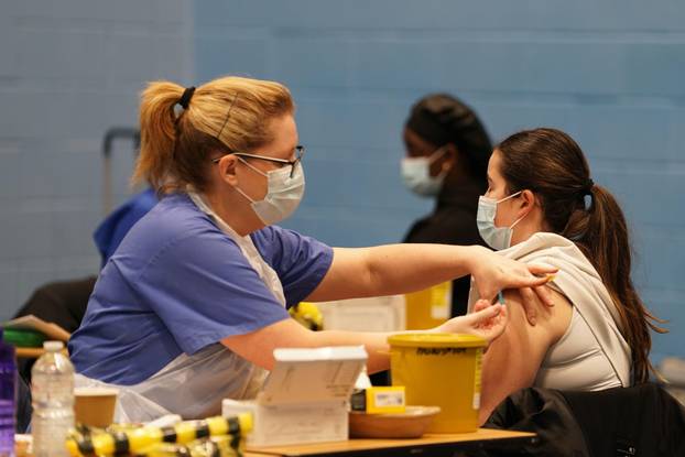A student receiving an injection in the sports hall at the University of Kent campus in Canterbury as the number of cases of meningitis being investigated by the UK Health Security Agency (UKHSA) in Kent has risen to 27. Picture date: Thursday March 19, 2