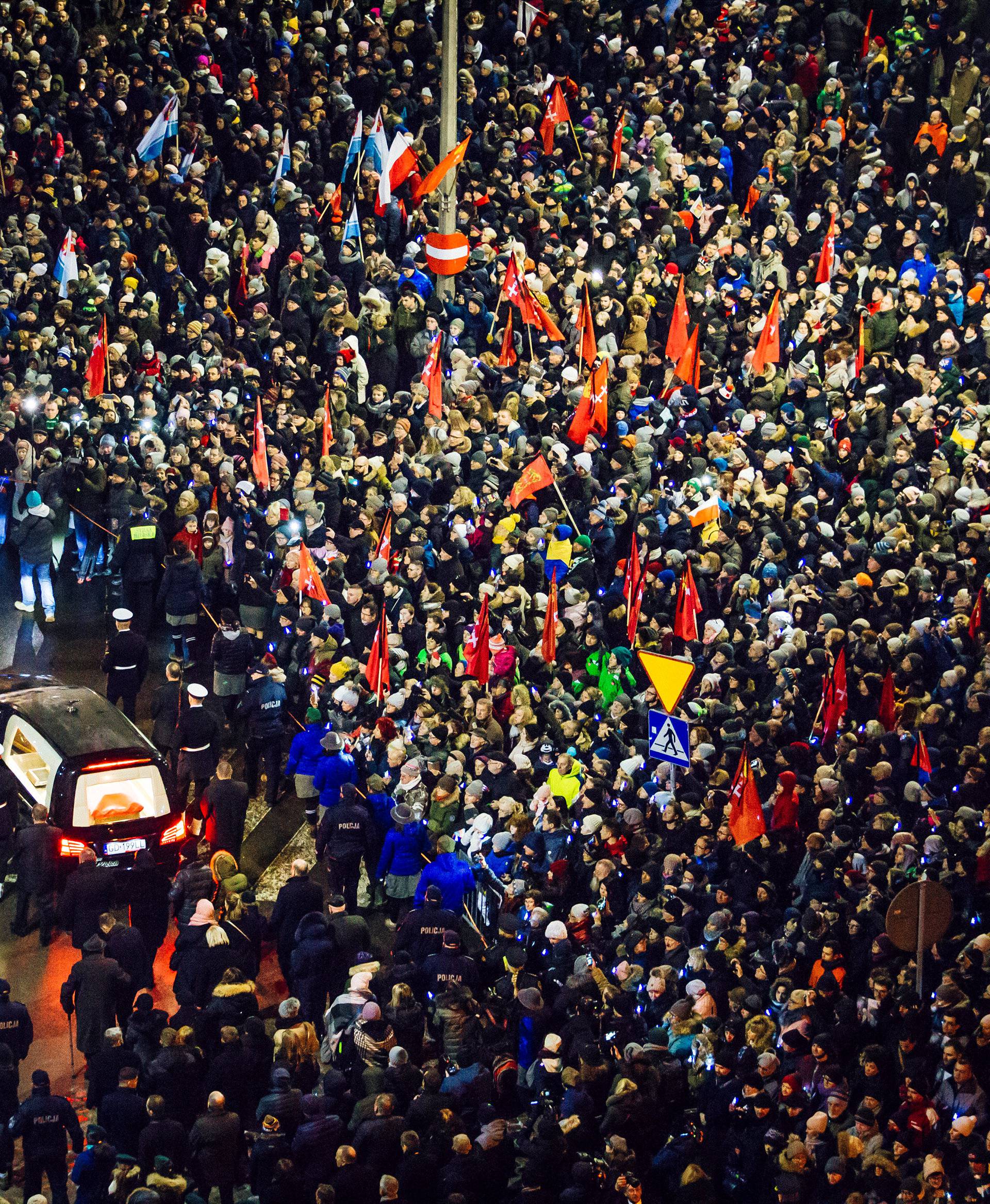 People take part in procession following the coffin of Gdansk mayor Pawel Adamowicz in front of the European Solidarity Centre in Gdansk