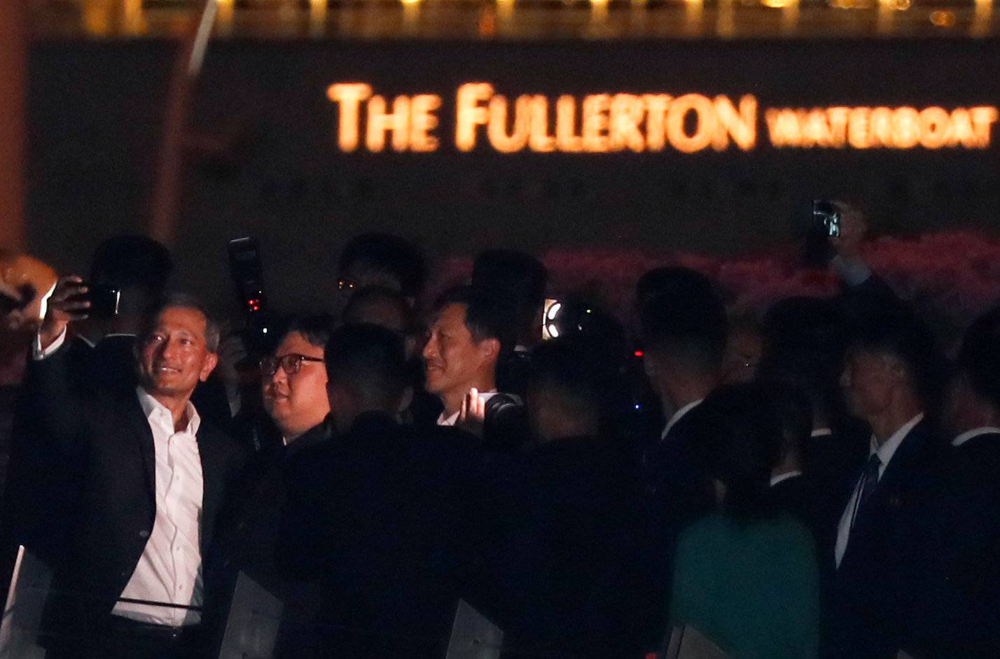 Singapore's Foreign Minister Vivian Balakrishnan takes a selfie with North Korea's leader Kim Jong Un during a visit in Merlion Park in Singapore