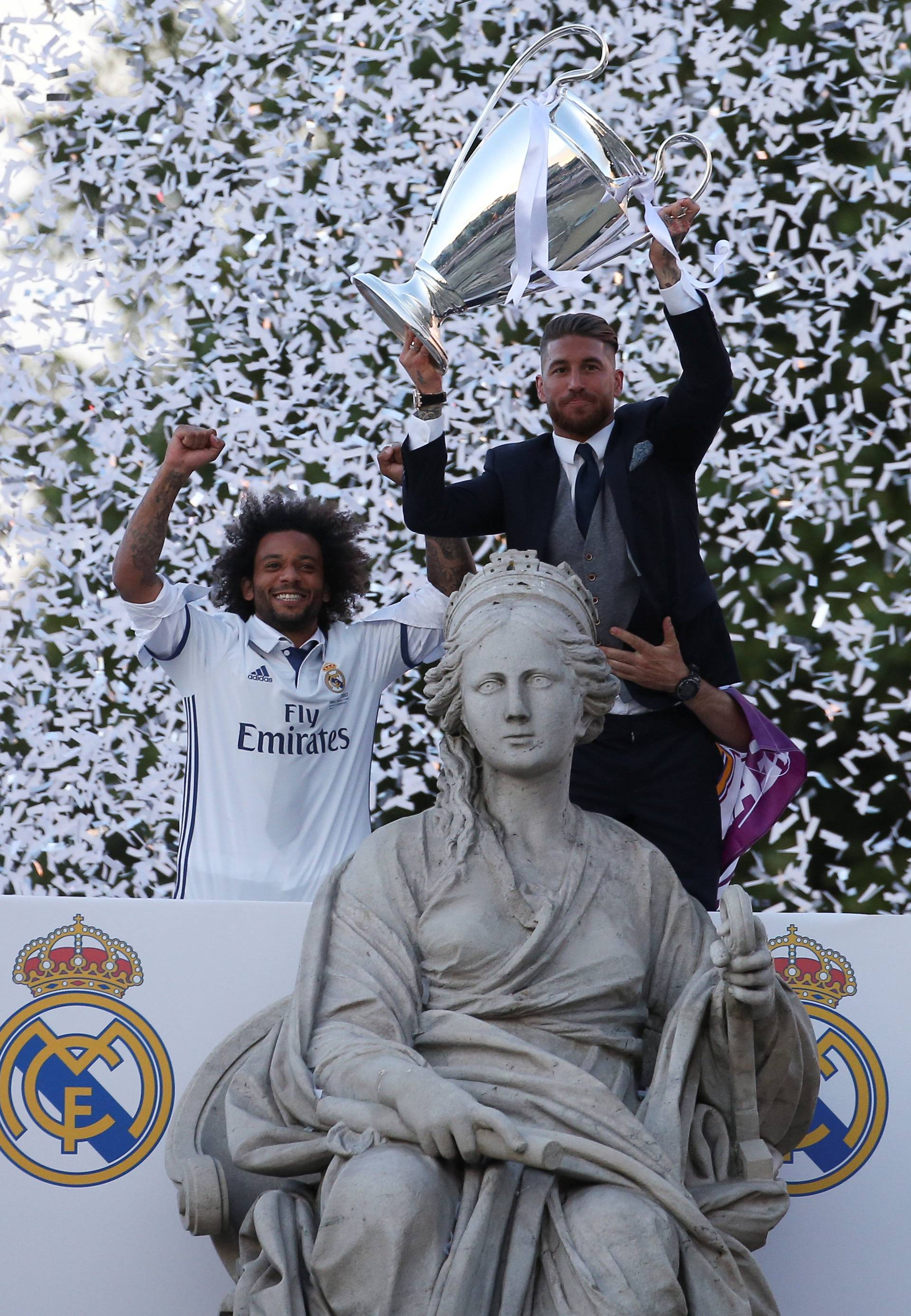 Real Madrid's Sergio Ramos and Marcelo celebrate Champions League title at Cibeles Fountain in Madrid