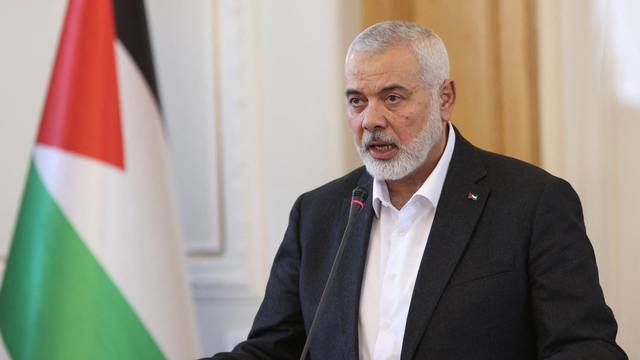Palestinian group Hamas' top leader, Ismail Haniyeh and Iran's Foreign Minister Hossein Amir Abdollahian attend a press conference in Tehran